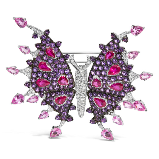 Broche papillon en or blanc 18 carats avec diamants, rubis, saphirs et améthystes (poids total 1,00 carat, couleur G-H, clarté VS1-VS2)