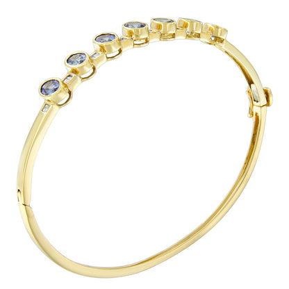 14K Yellow Gold Alternating Bezel Set 5MM Oval Shaped Tanzanite and 1/5 Cttw Diamond Bangle Bracelet (H-I Color, VS2-SI1 Clarity) - Fit's wrists up to 7.25" Inches