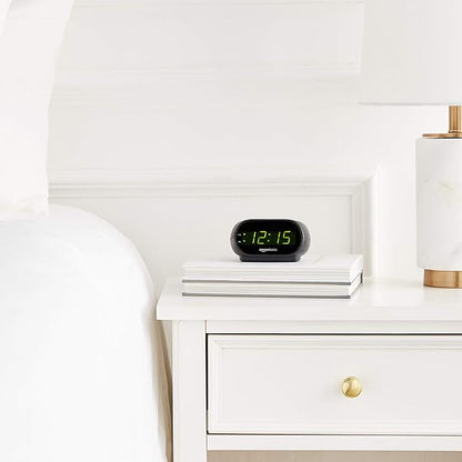 Amazon Basics Small Digital Oval Alarm Clock With LED Display, Nightlight & Battery Backup, Black, 4.5 x 3.5 x 2.4 Inches