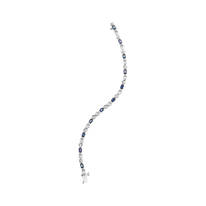 10K White Gold 5x4mm Oval Sapphire Gemstone and 1/10 Cttw Diamond Prong Set "X" Link Bracelet - Size 7" (H-I Color, SI1-SI2 Clarity)