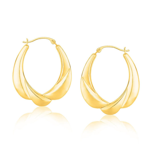 Boucles d'oreilles créoles ovales dégradées motif coquillage en or jaune 14 carats