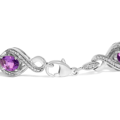 .925 Sterling Silver 1/10 Cttw Natural Round Diamond and 7X5MM Oval Amethyst Cross Tennis Bracelet (I-J Color, I1-I2 Clarity) - 7"