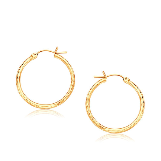 Créoles fines en or jaune 14 carats avec finition taille diamant (25 mm de diamètre)