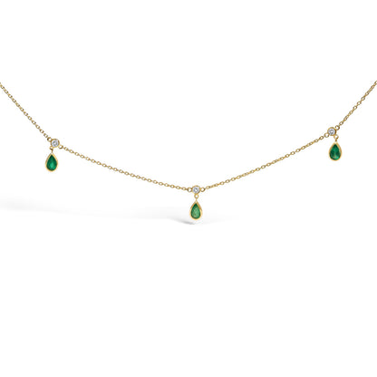 10K Yellow Gold Dangling 5x3 mm Green Emerald and Diamond Station Necklace - 18" Inches