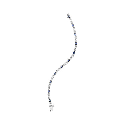 10K White Gold 5x4mm Oval Sapphire Gemstone and 1/10 Cttw Diamond Prong Set "X" Link Bracelet - Size 7" (H-I Color, SI1-SI2 Clarity)